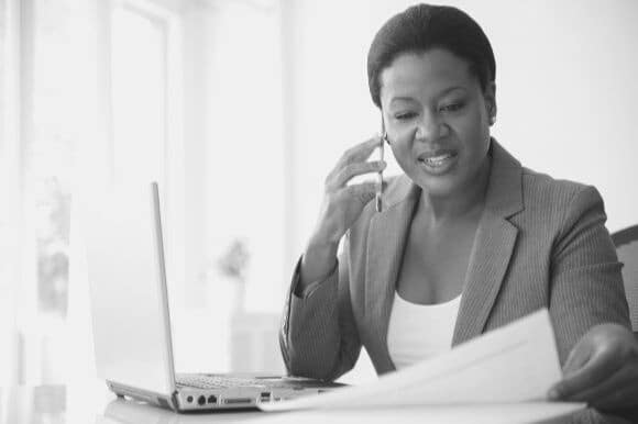 Manager asking phone interview questions in office